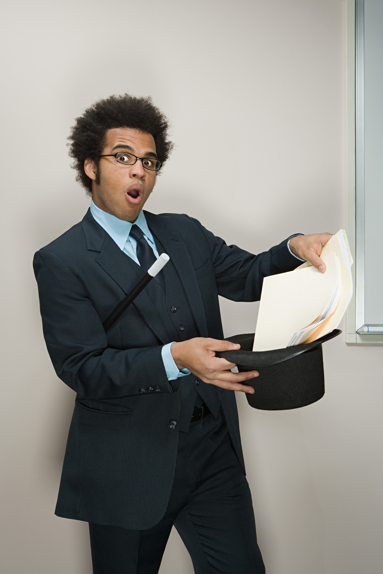 Businessman Performing Magic Tricks